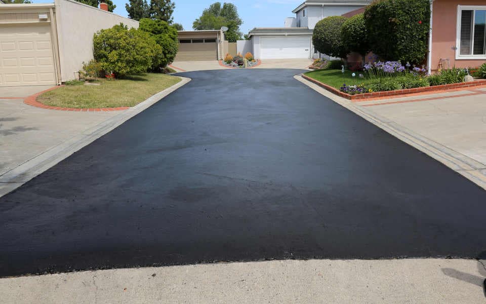 Driveway that has just had sealcoating applied to it. 