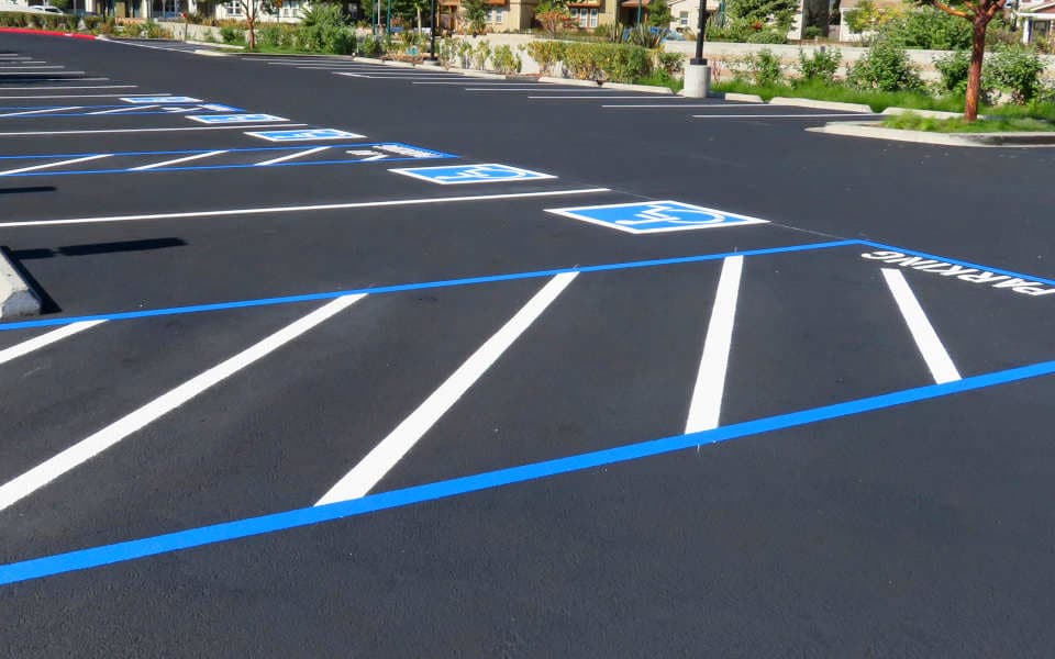 Parking lot that has been sealcoated and restriped