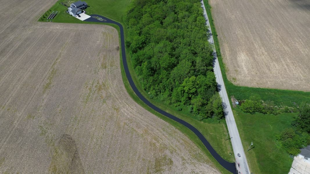 Driveway that has just had sealcoating applied to it. 